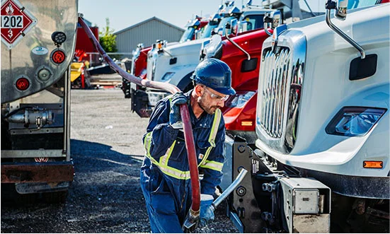 Fuelling trucks with staff member
