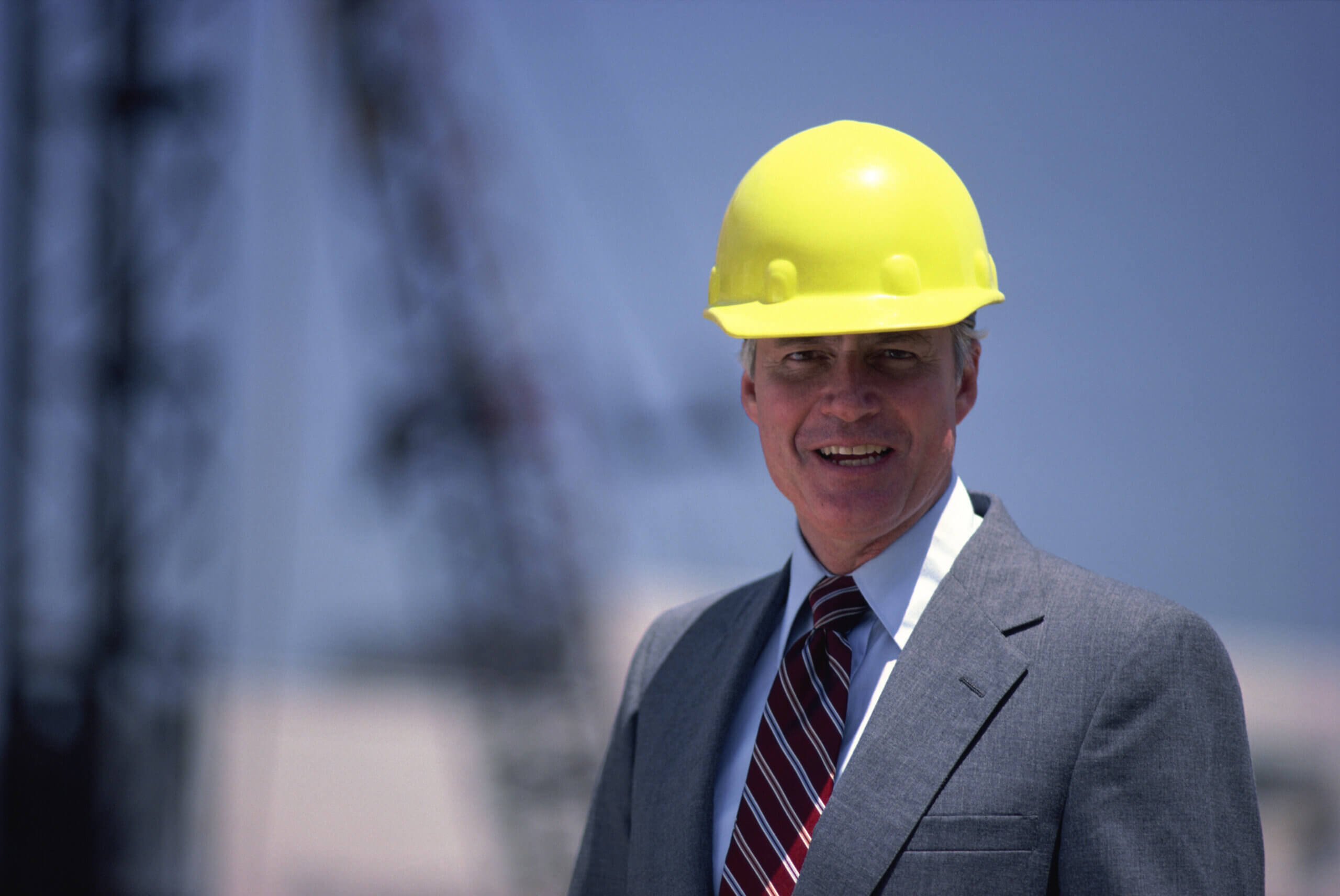 Smiling businessman with a hardhat
